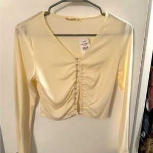 Cropped long sleeve cream top